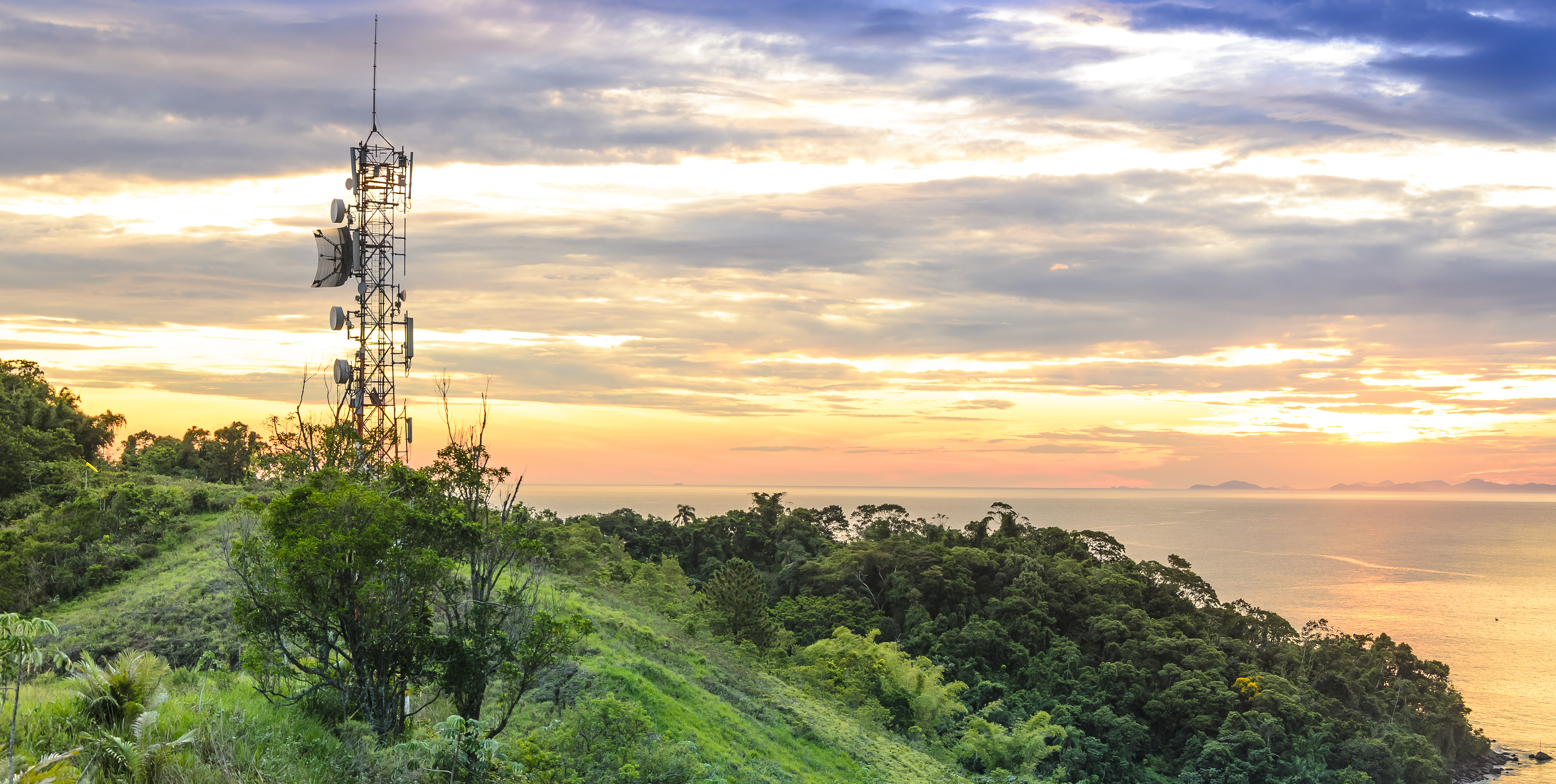 Telecommunications And  Radio Towers With Sunset Sky In Backgrou